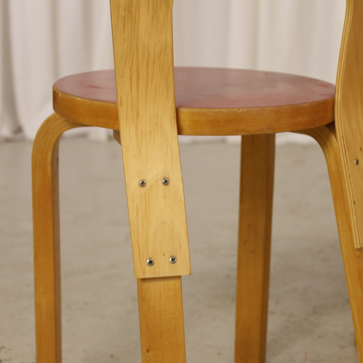 Alvar Aalto Chair 65 in Birch and Red Linoleum for Artek, rear detail showing replaced backrest screws on Chair 65