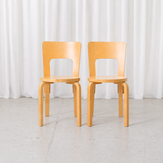 Pair of vintage Artek Chair 66 chairs by Alvar Aalto in natural birch, front view