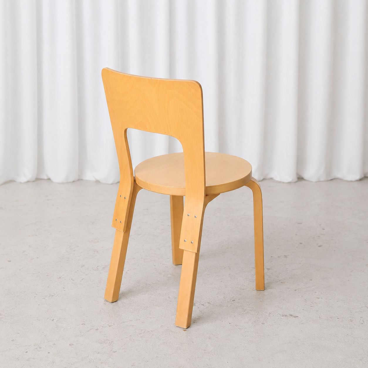 Vintage Artek Chair 66 by Alvar Aalto in natural birch, rear three-quarter view