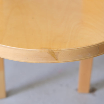Close-up of a repaired area on the seat edge of a vintage Artek Chair 66