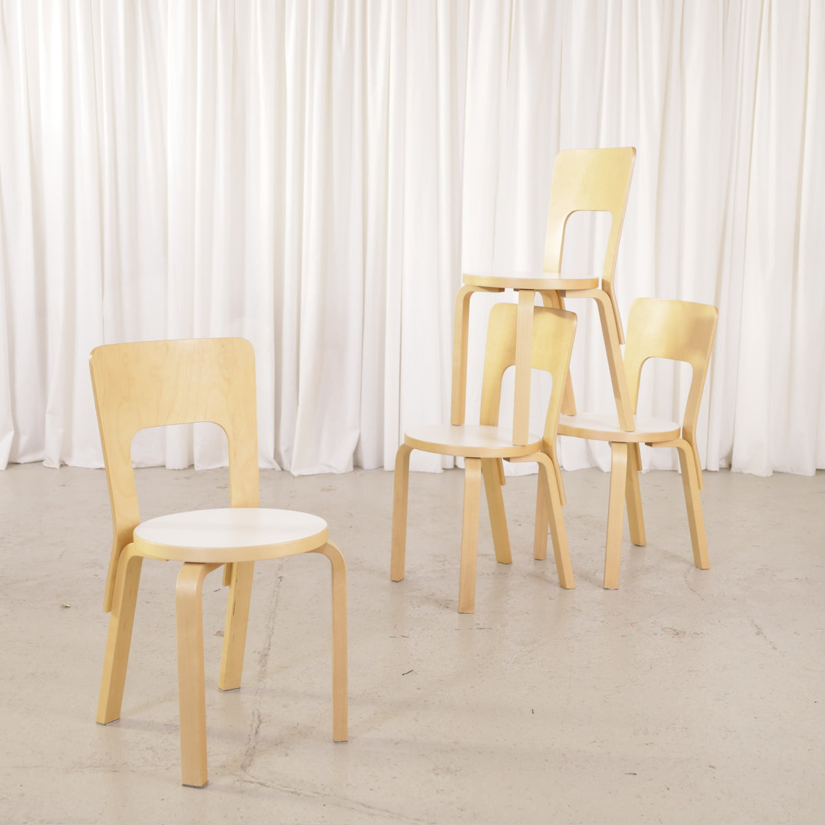 Alvar Aalto Chair 66 with White Laminate Seat for Artek, Four Available, four Artek Chair 66 chairs in birch and white laminate, group view