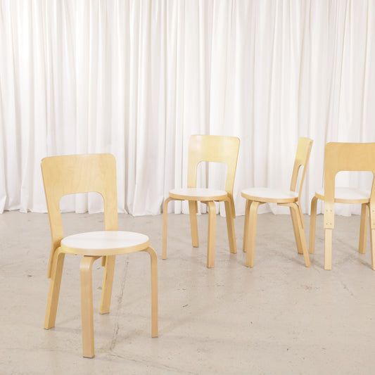 Alvar Aalto Chair 66 with White Laminate Seat for Artek, Four Available, four Artek Chair 66 chairs, group angled view