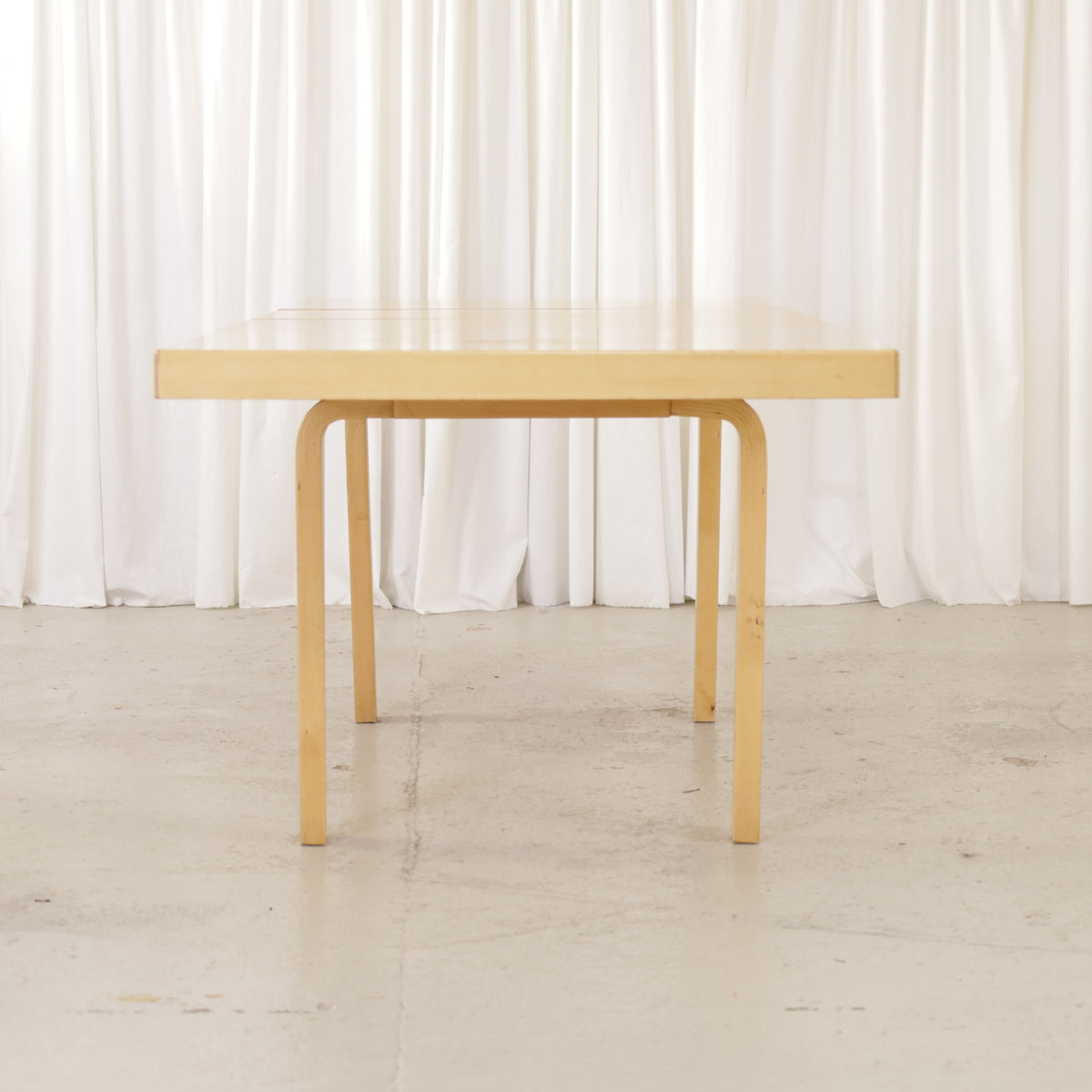 Alvar Aalto Model 92 Extendable Dining Table by Artek, end view of Alvar Aalto Model 92 dining table by Artek