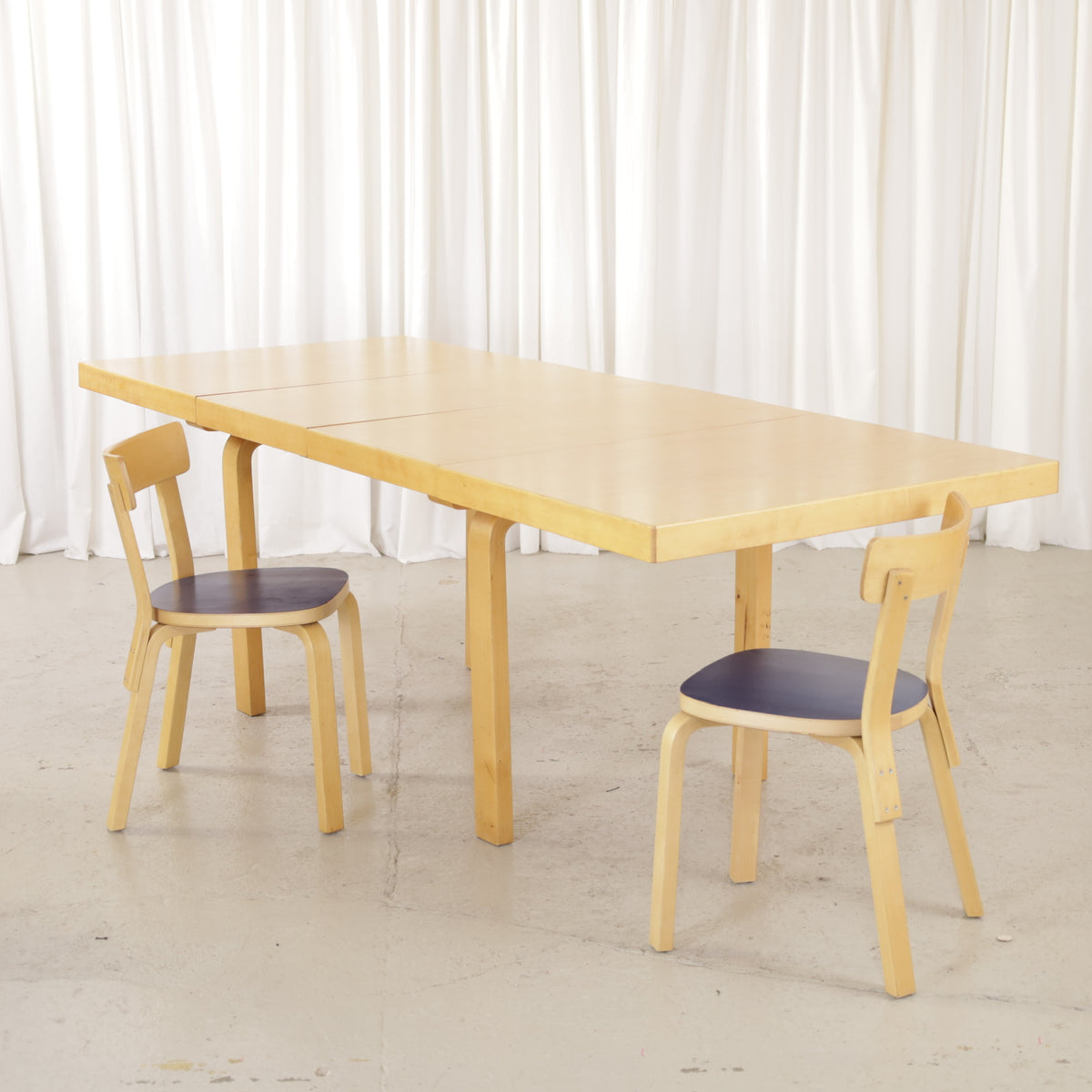 Alvar Aalto Model 92 Extendable Dining Table by Artek, alvar Aalto Model 92 dining table by Artek shown extended with chairs