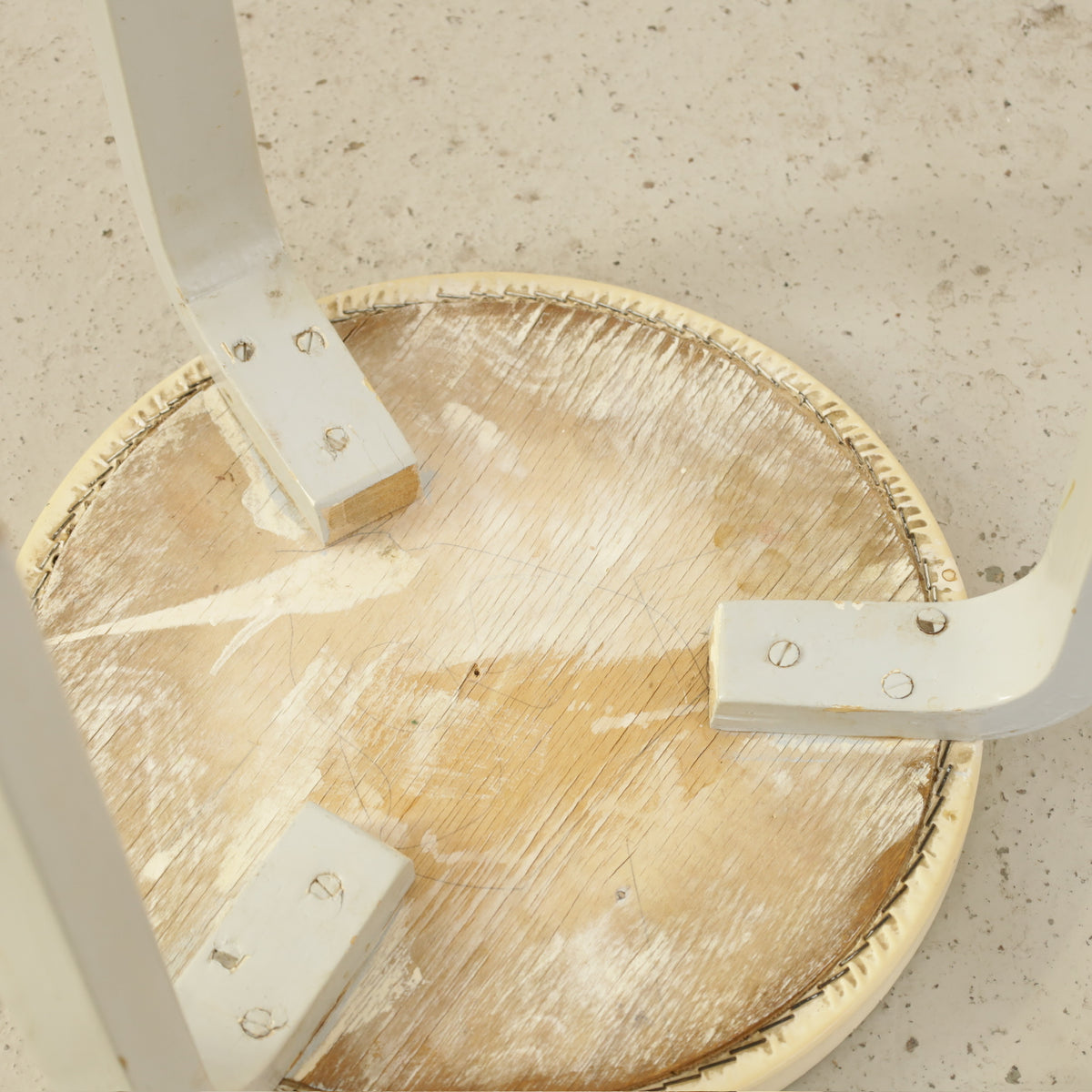 Alvar Aalto Stool 60 for Artek with Light Upholstered Seat, underside of Artek Stool 60 showing wood seat base and leg attachments