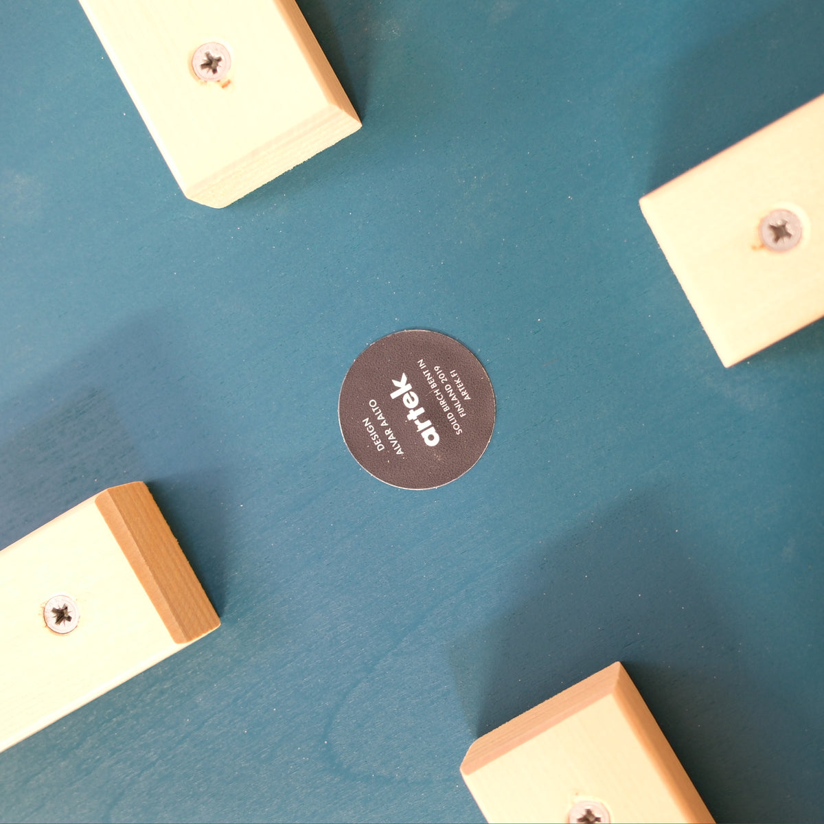 Alvar Aalto Stool E60 with Blue-Green Seat for Artek, artek E60 stool underside with manufacturer label and birch legs