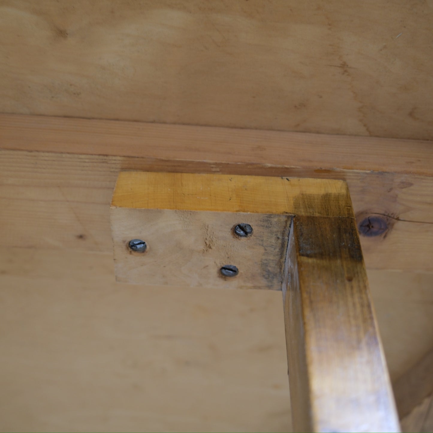 Original screws and underside joinery of the vintage dining table