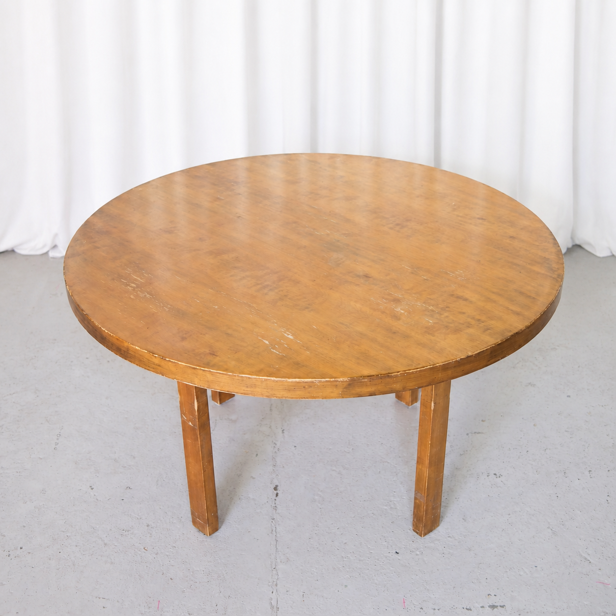 Alvar Aalto round birch dining table from an elevated angle