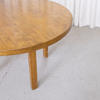 Patinated birch tabletop edge and legs of the Aalto dining table