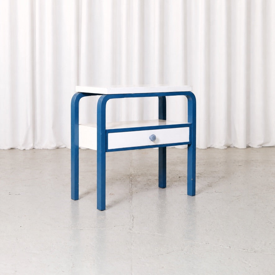 Blue and white Artek side table with drawer, front view
