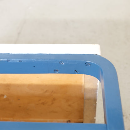 Close-up of marks on the blue birch frame