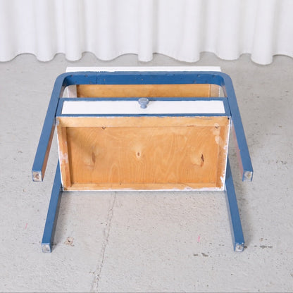 Underside view of the Artek side table and drawer construction