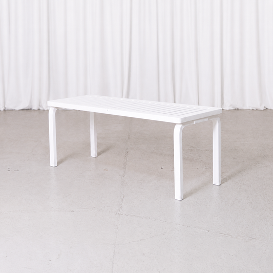 White Artek 153A slatted bench by Alvar Aalto, three-quarter view