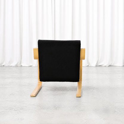 Rear view of the second 1960s Artek 402 armchair with black fabric upholstery
