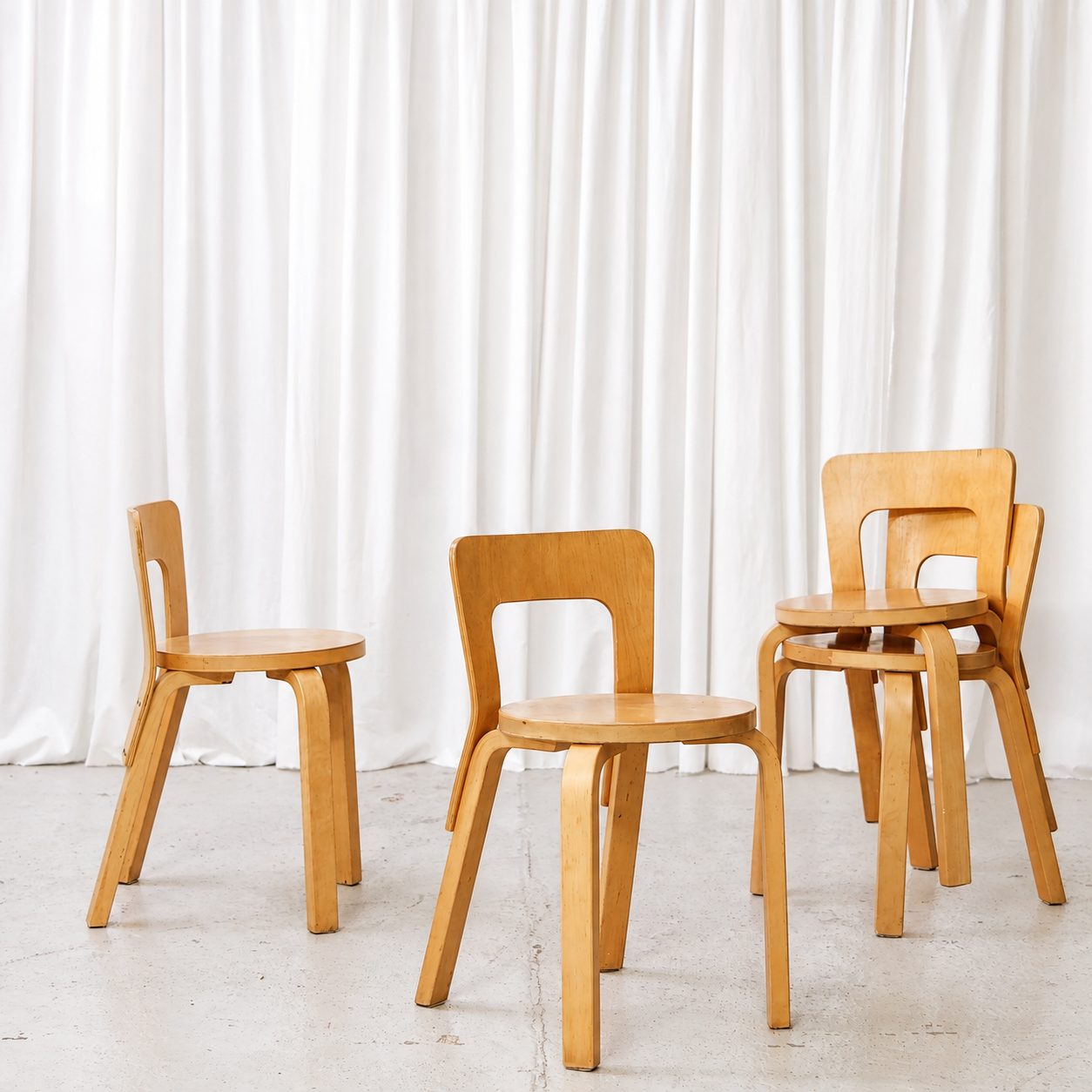 Vintage Artek 65 chair in birch with finger-jointed legs and honey-toned patina