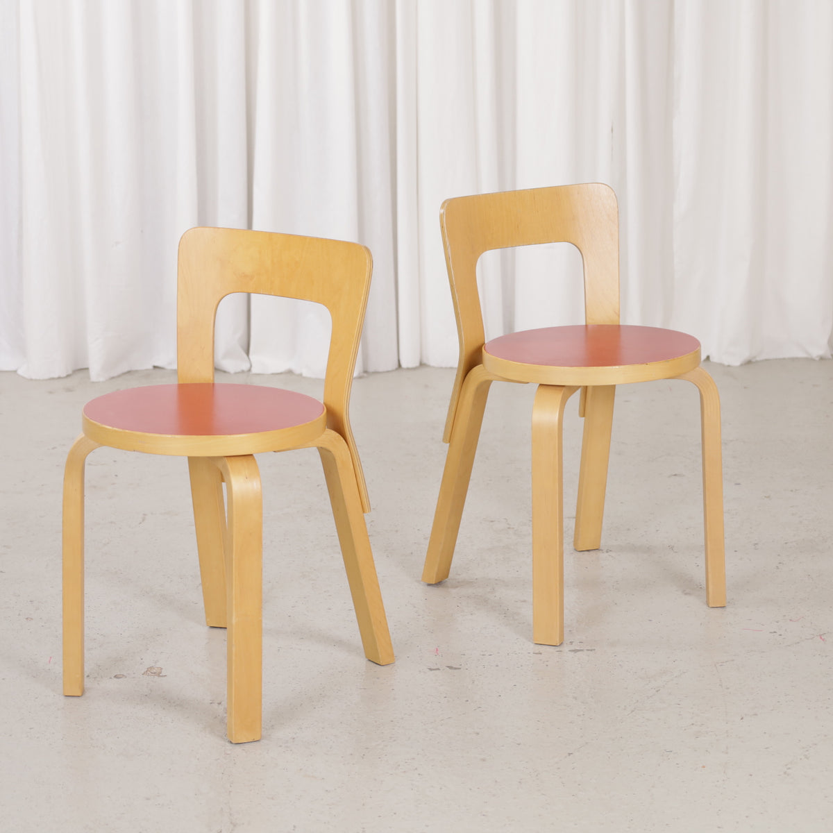 Pair of Artek Chair 65 chairs with warm birch patina