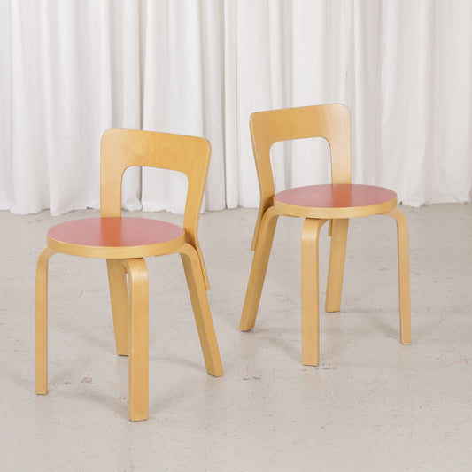 Pair of Artek Chair 65 chairs with warm birch patina
