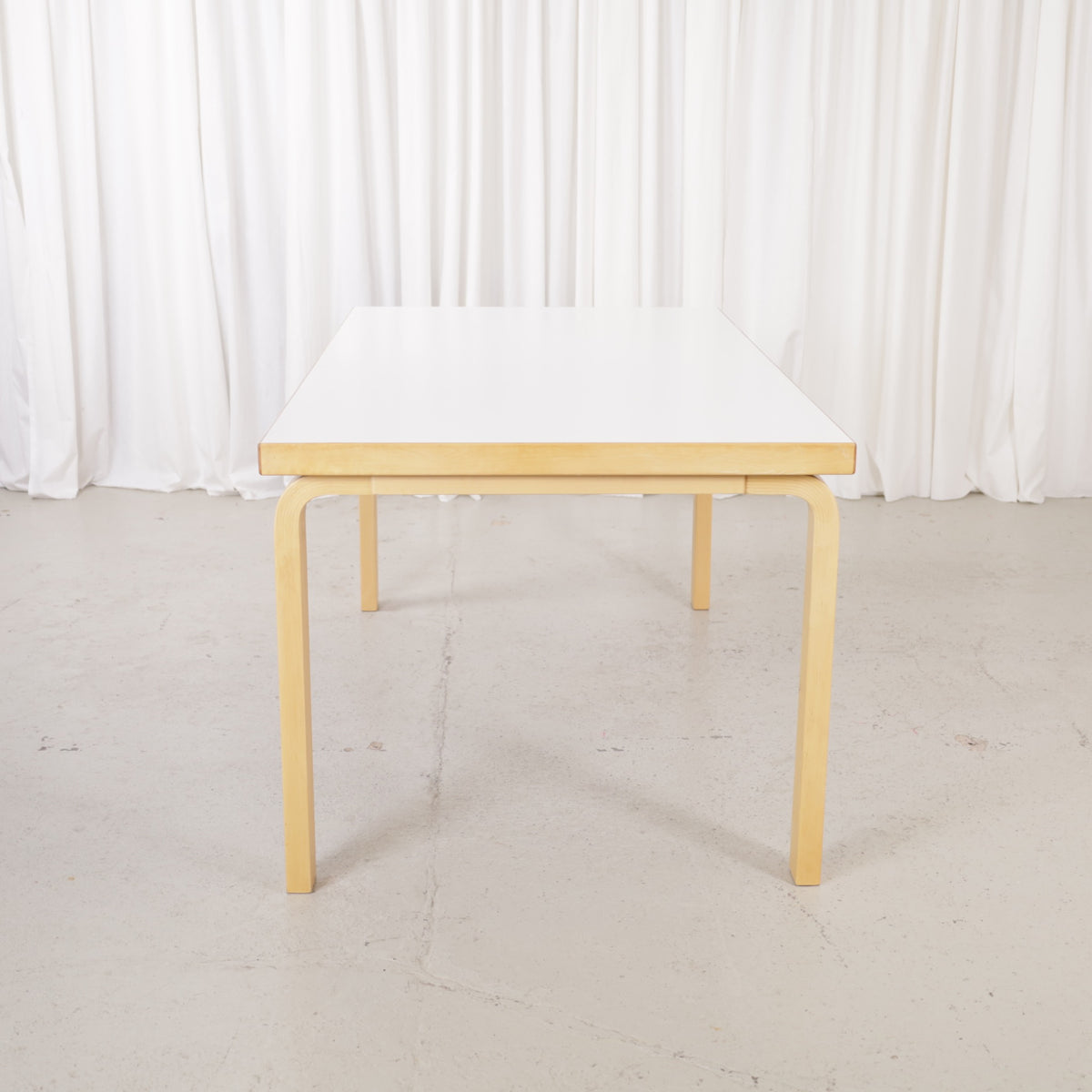 Alvar Aalto 82A table for Artek with white top and birch legs — full table view
