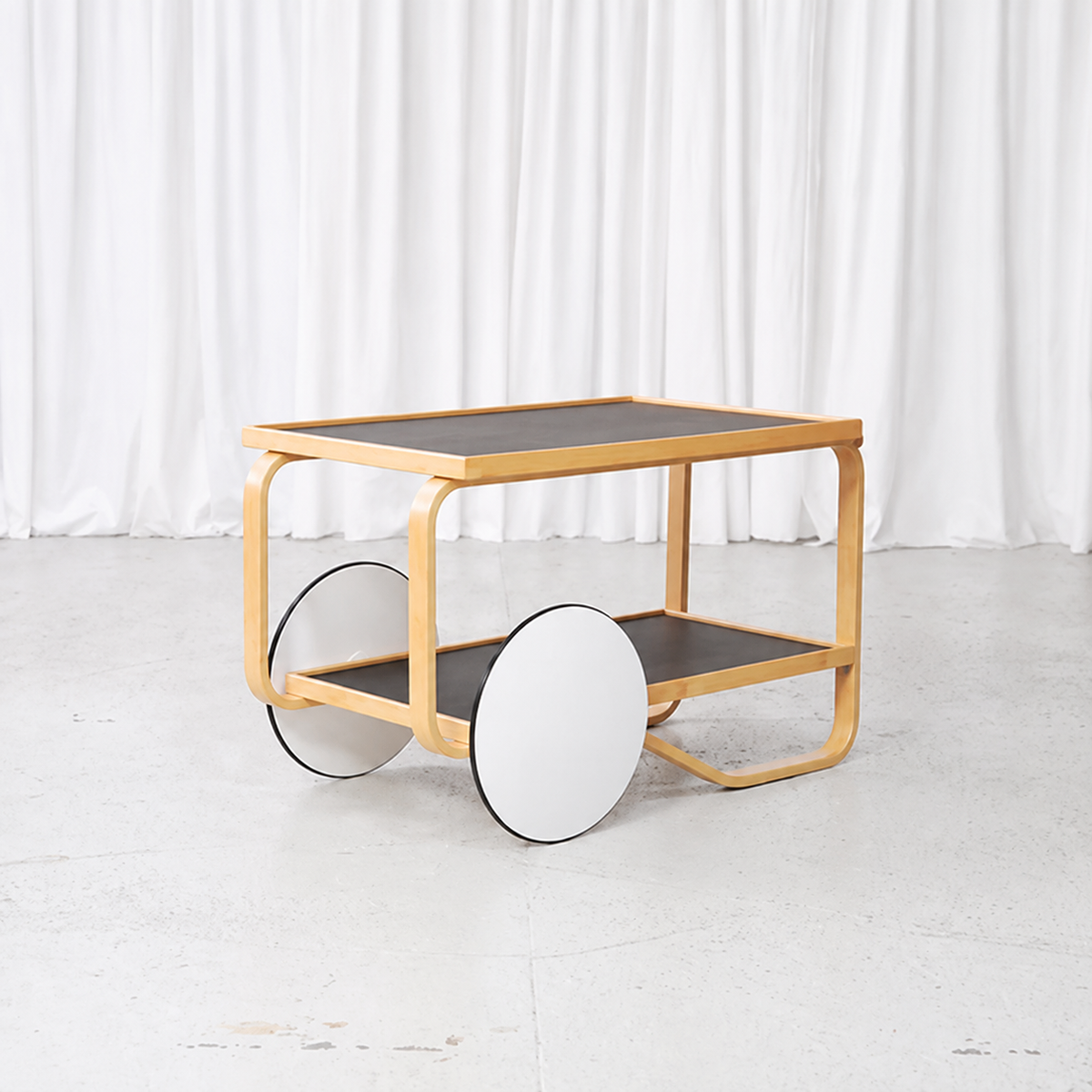 Artek 901 tea trolley in birch with black linoleum shelves
