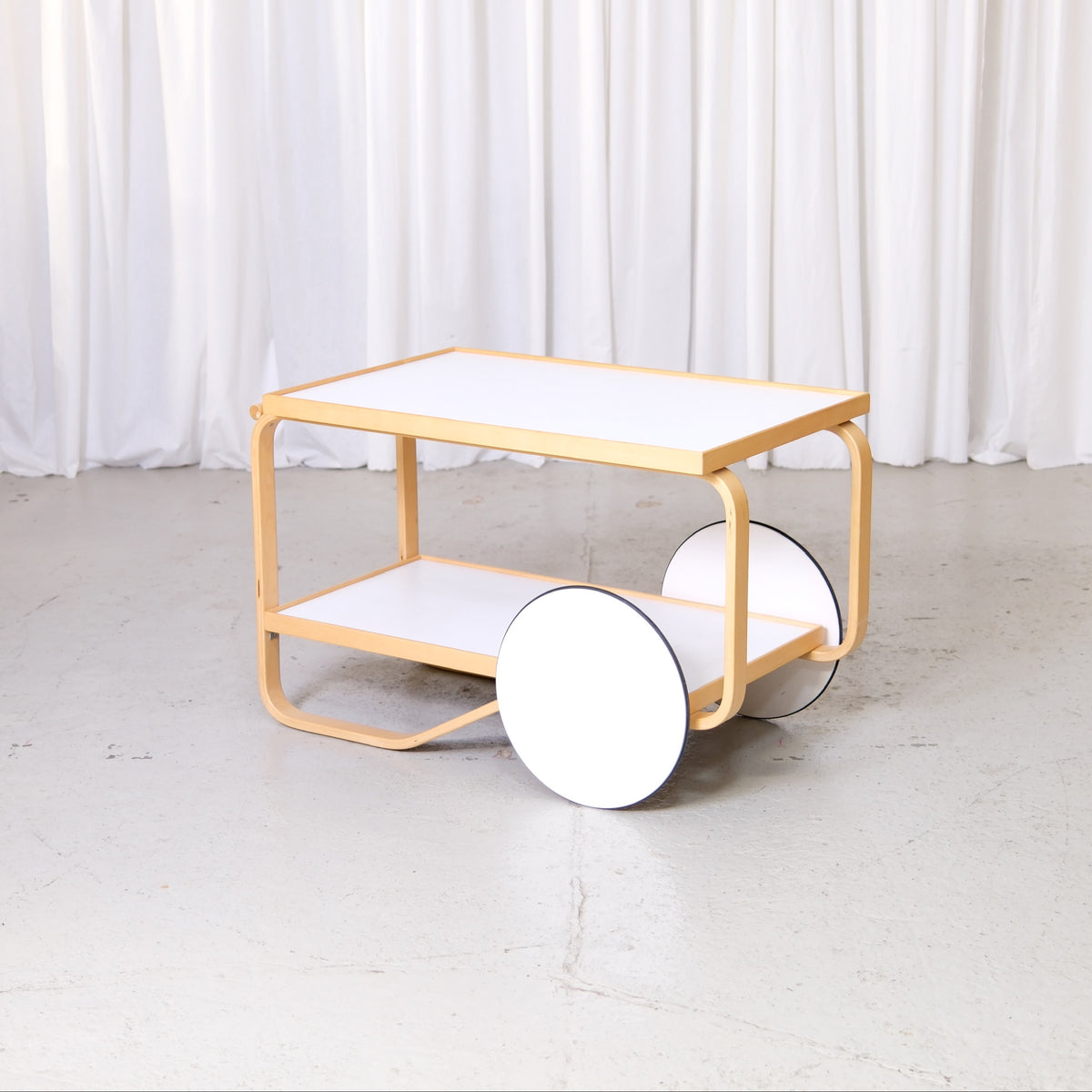 Artek 901 Tea Trolley in White Laminate by Alvar Aalto, artek 901 tea trolley by Alvar Aalto with white laminate shelves, full view