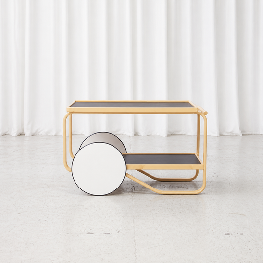 Side view of Artek 901 tea trolley with white wheels