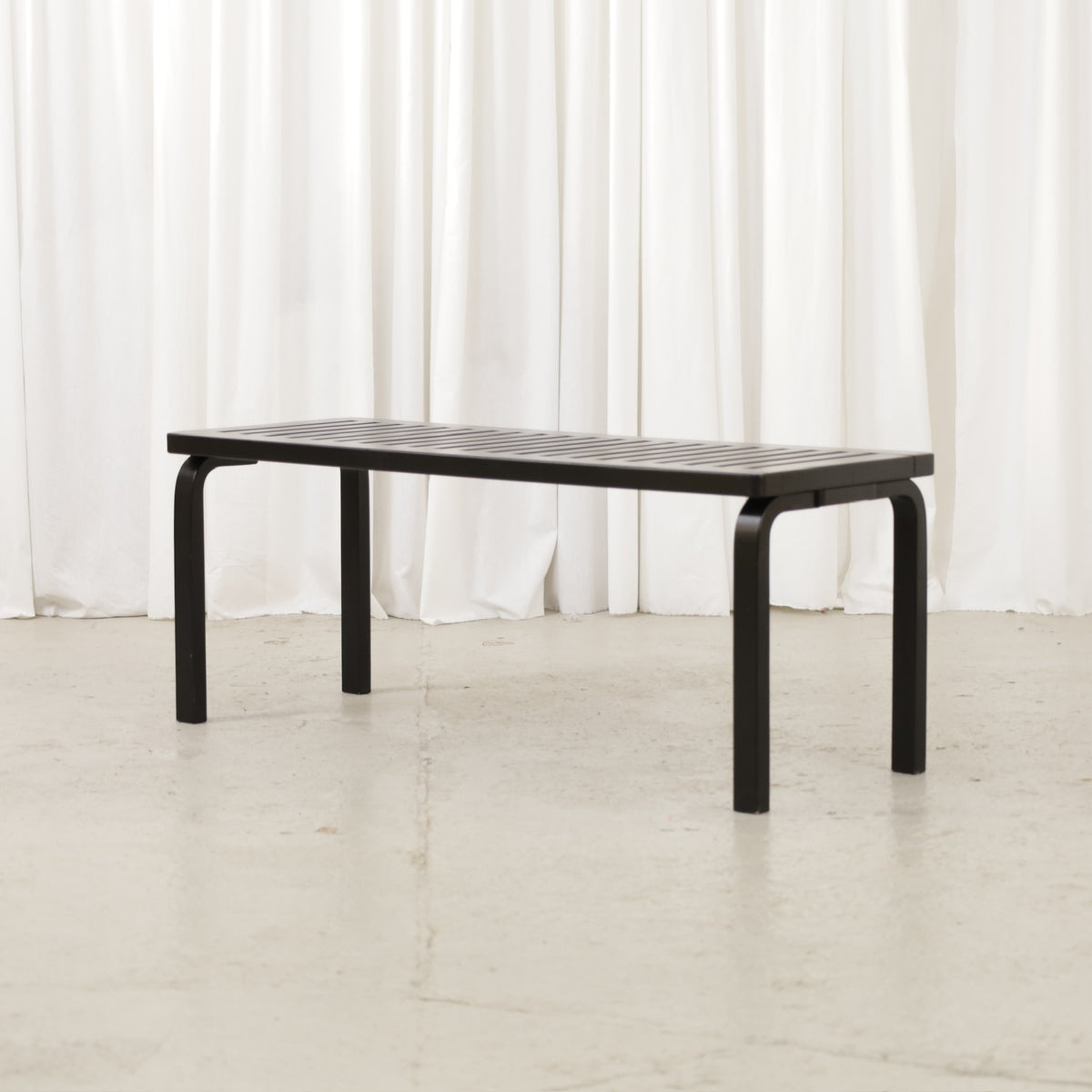 Artek Bench 153A by Alvar Aalto, black, black Artek Bench 153A, angled view
