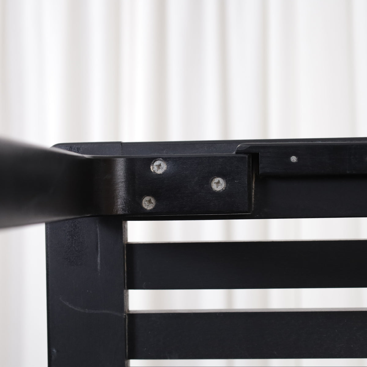 Artek Bench 153A by Alvar Aalto, black, close-up of bench leg attachment