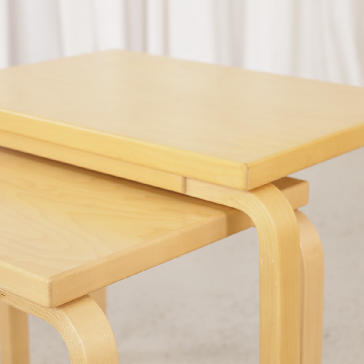Alvar Aalto birch nesting tables for Artek — tabletop and bent leg detail