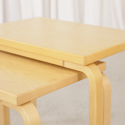 Alvar Aalto birch nesting tables for Artek — tabletop and bent leg detail