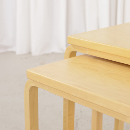 Alvar Aalto birch nesting tables for Artek — tabletop and bent leg detail