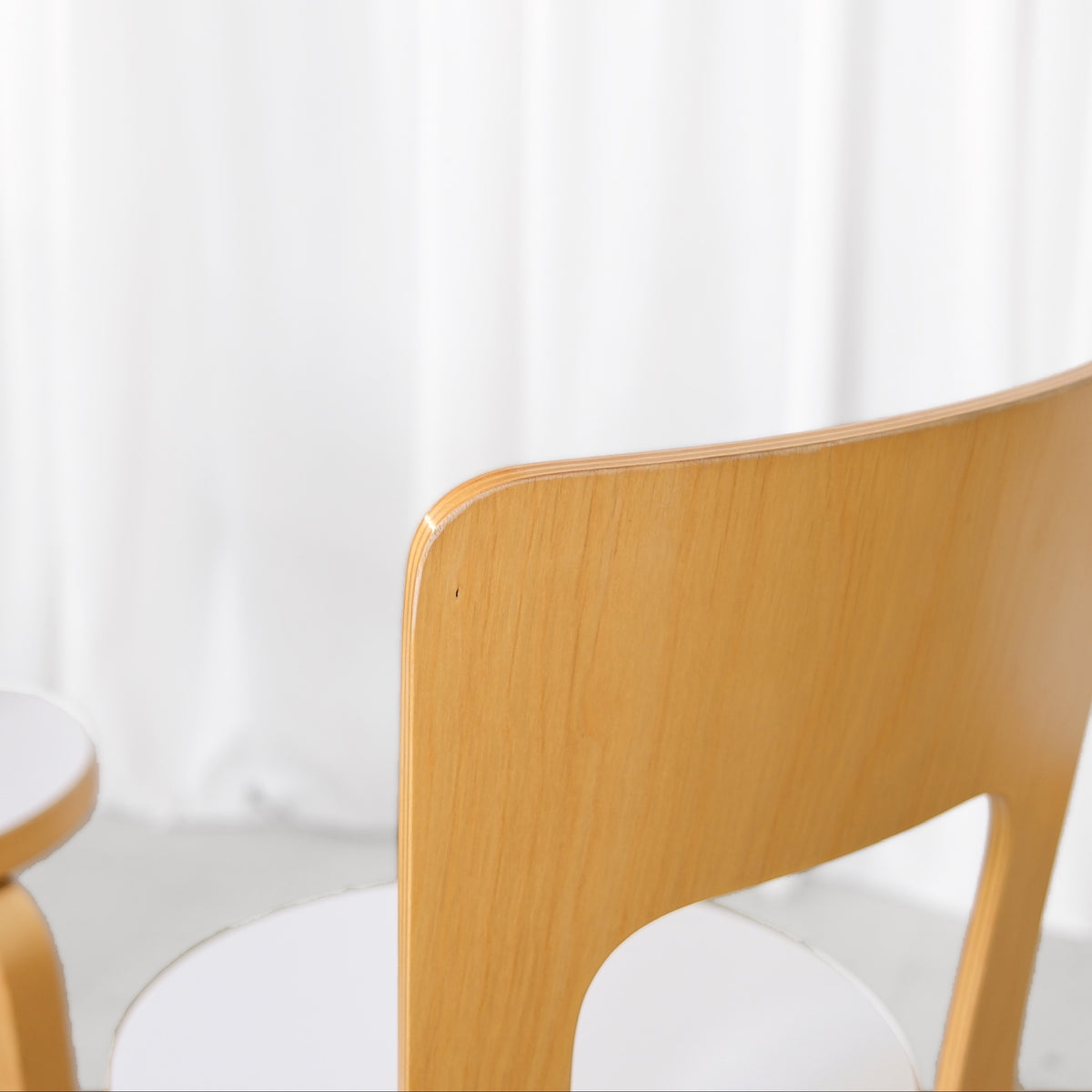 Close-up of wear along the edge of an Artek Chair 66 backrest