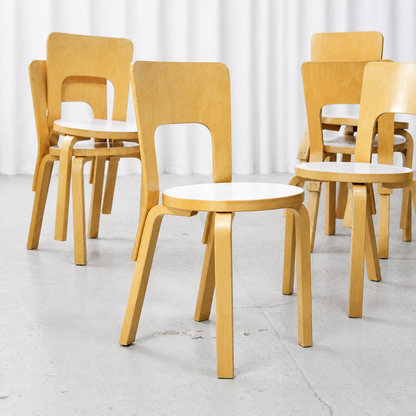 Front view of Artek Chair 66 with white laminate seat