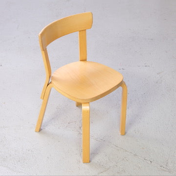 Artek Chair 69 showing its curved birch seat and backrest