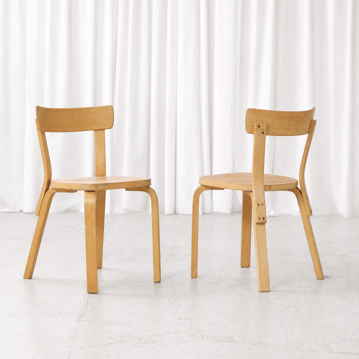 Front and rear views of 1950s Artek Chair 69 chairs