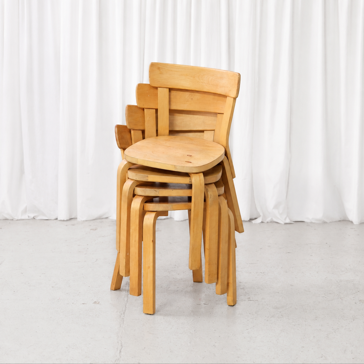 Four 1950s Artek Chair 69 chairs stacked together