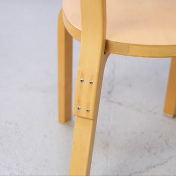 Rear leg and mounting screw detail on Artek Chair 69