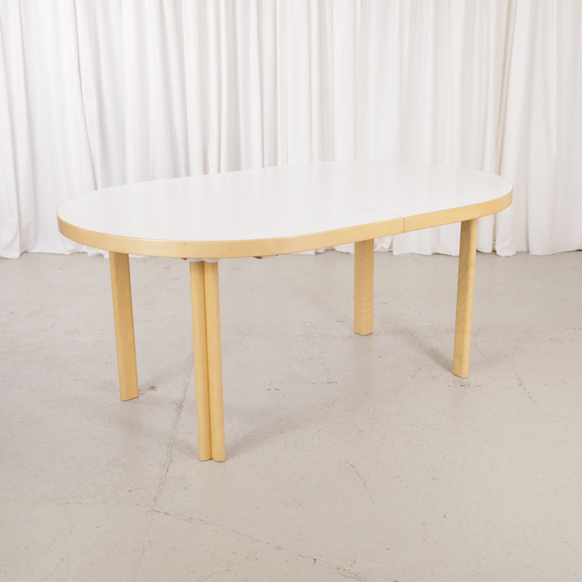 Artek H99 extendable table in white laminate and birch — full table view