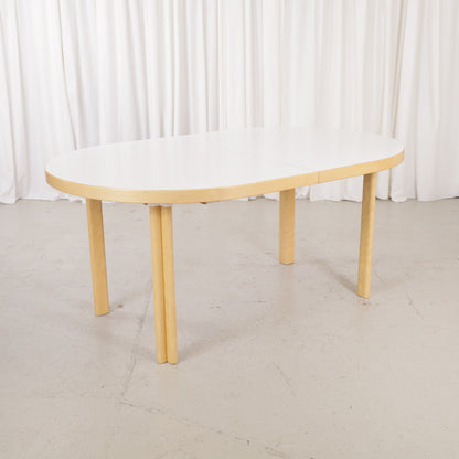 Artek H99 extendable table in white laminate and birch — full table view