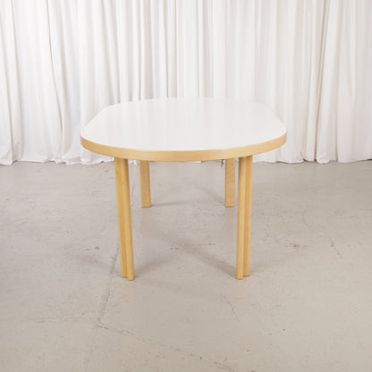 Artek H99 extendable table in white laminate and birch — full table view