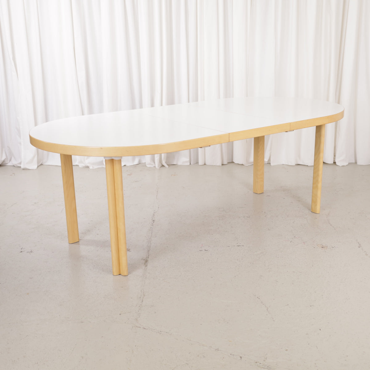 Artek H99 extendable table in white laminate and birch — full table view