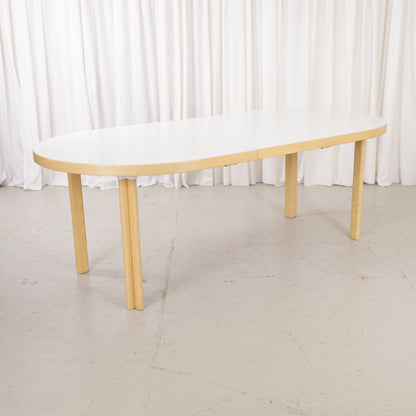 Artek H99 extendable table in white laminate and birch — full table view