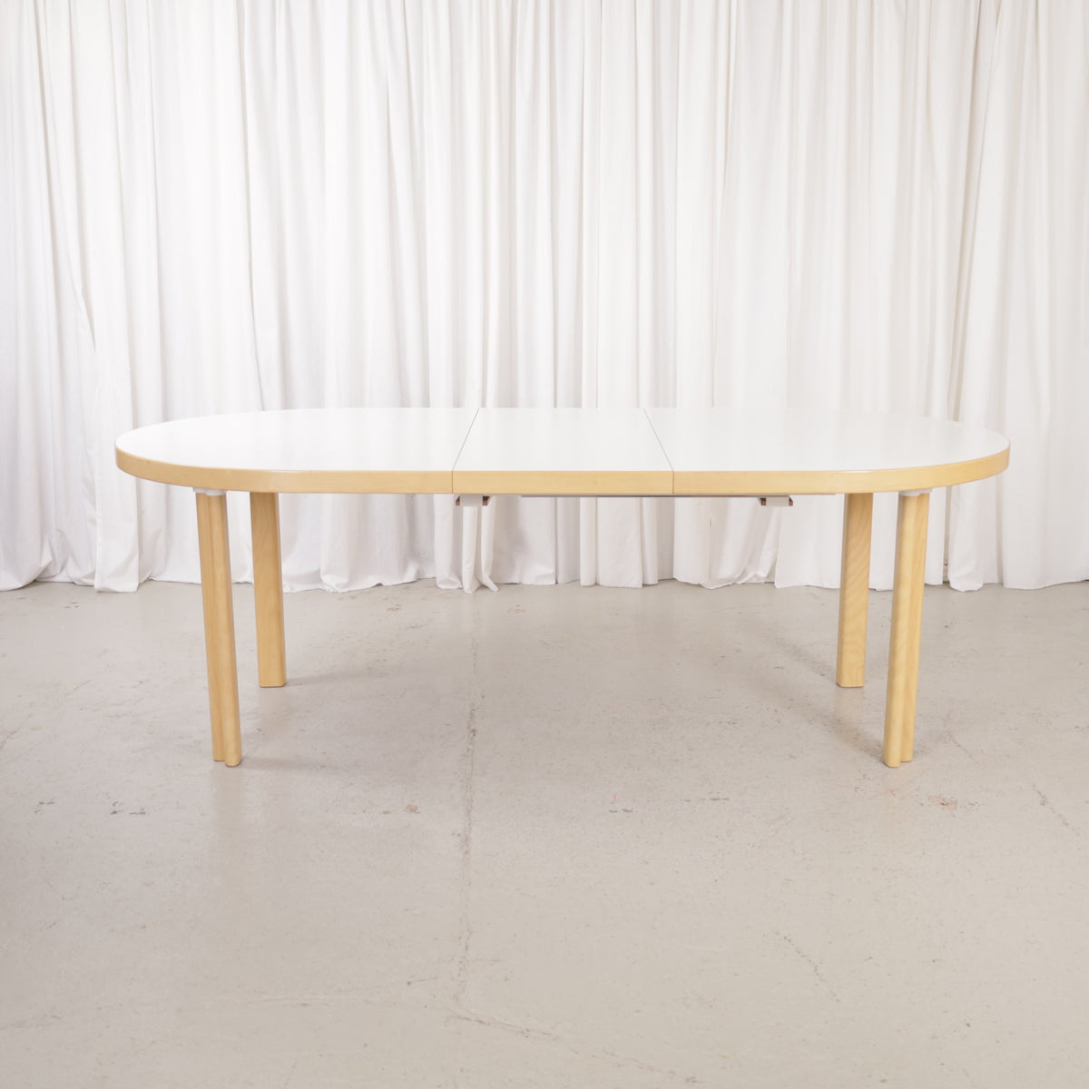 Artek H99 extendable table in white laminate and birch — full table view