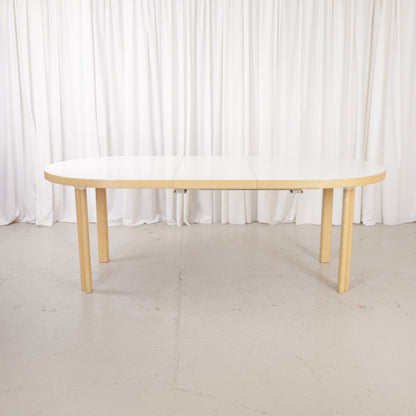 Artek H99 extendable table in white laminate and birch — full table view