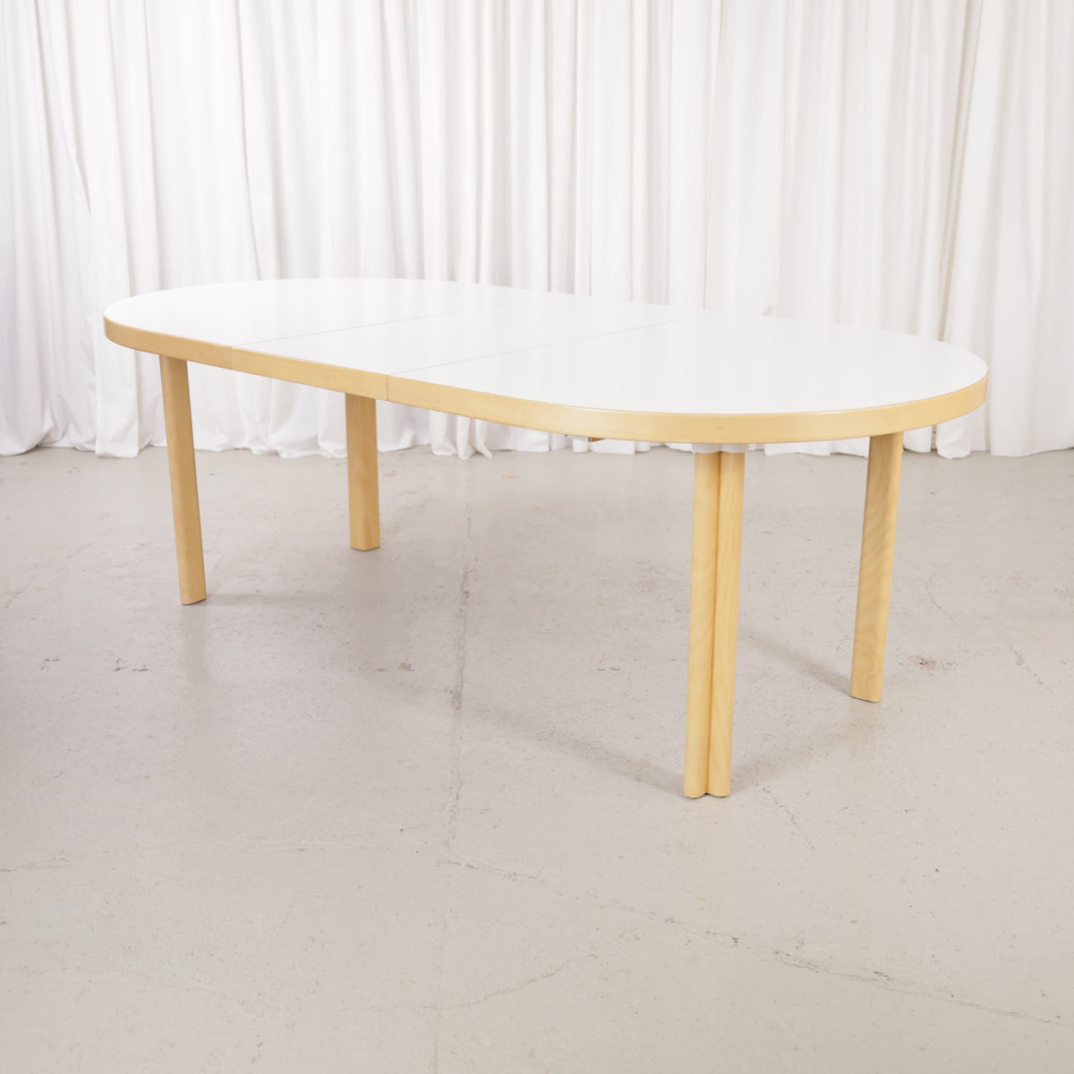 Artek H99 extendable table in white laminate and birch — full table view