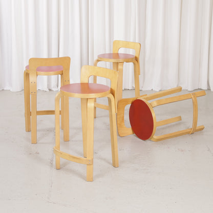 Alvar Aalto K65 high chair for Artek in patinated birch with a red linoleum seat