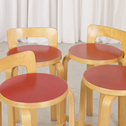 Alvar Aalto K65 high chair for Artek in patinated birch with a red linoleum seat