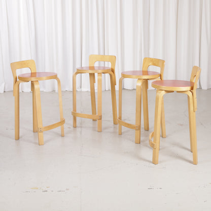 Alvar Aalto K65 high chair for Artek in patinated birch with a red linoleum seat