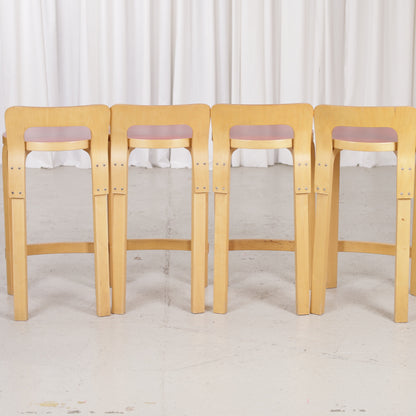 Alvar Aalto K65 high chair for Artek in patinated birch with a red linoleum seat
