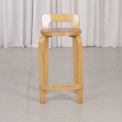 Alvar Aalto K65 high chair for Artek in patinated birch with a red linoleum seat