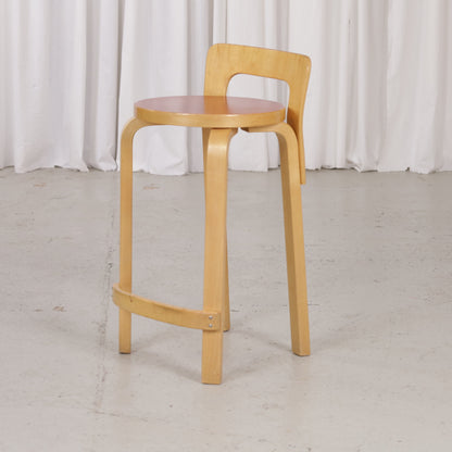 Alvar Aalto K65 high chair for Artek in patinated birch with a red linoleum seat